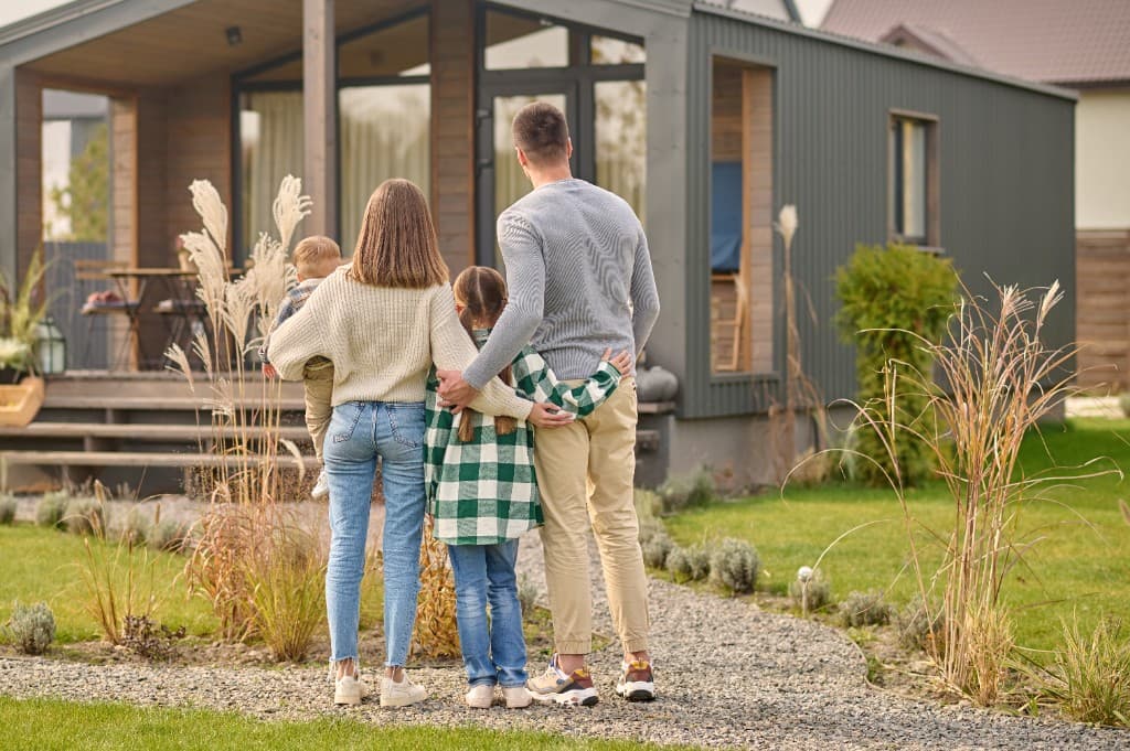 Family admiring their first home